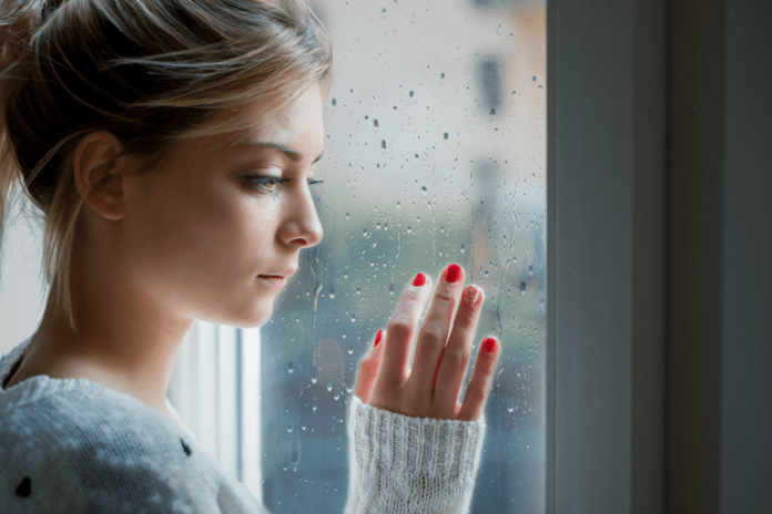 Canva-Worried-and-alone-girl-next-to-the-window-light-768x512-1.png