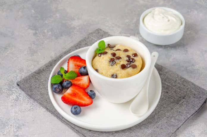 mug-cake-with-chocolate-chips-fresh-berries-cream-gray-concrete-background-copy-space_114420-1672.jp_.jpeg