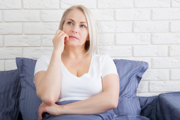 sad-woman-sitting-bed-morning-depressed-menopause_199352-70.jpg